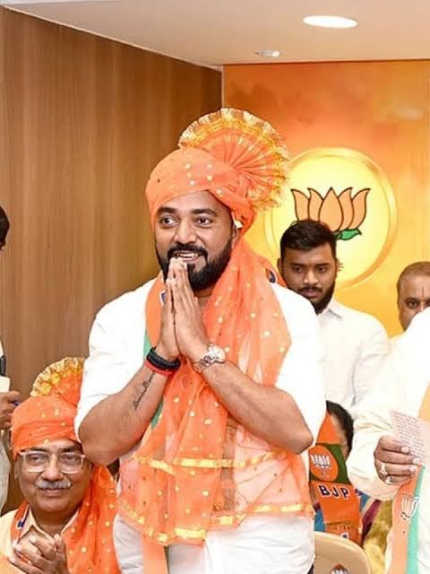 Rahul Awade greeting attendees with folded hands at a party programme after his election as MLA for Ichalkaranji.