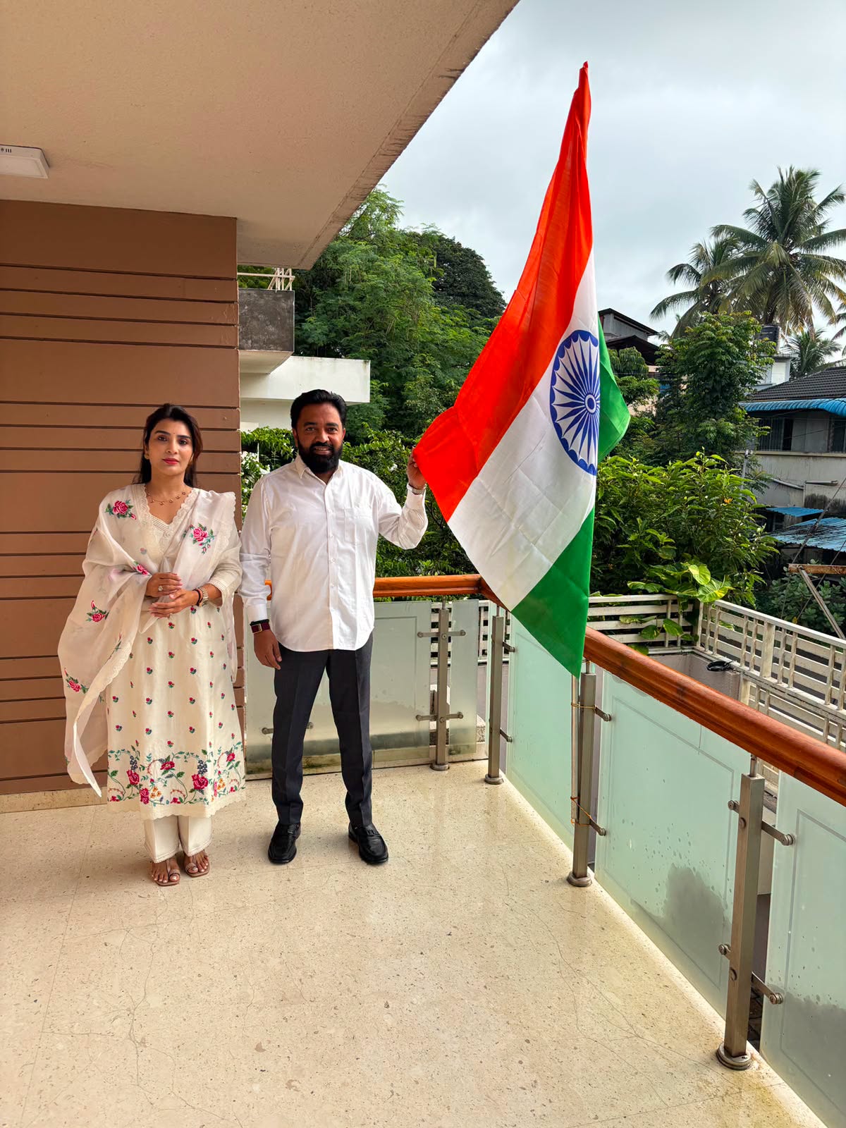 Rahul Awade unfurling the National Flag on the balcony of his residence in Ichalkaranji.