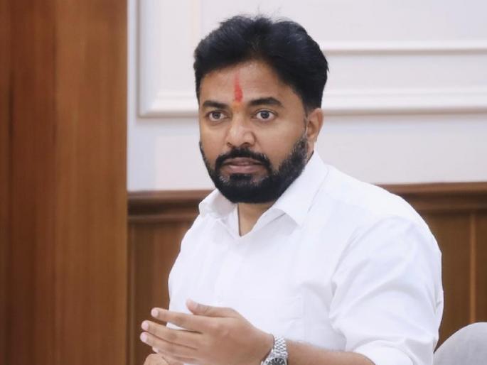 Rahul Awade, MLA for Ichalkaranji, speaking at an official meeting in a wood-panelled government room.
